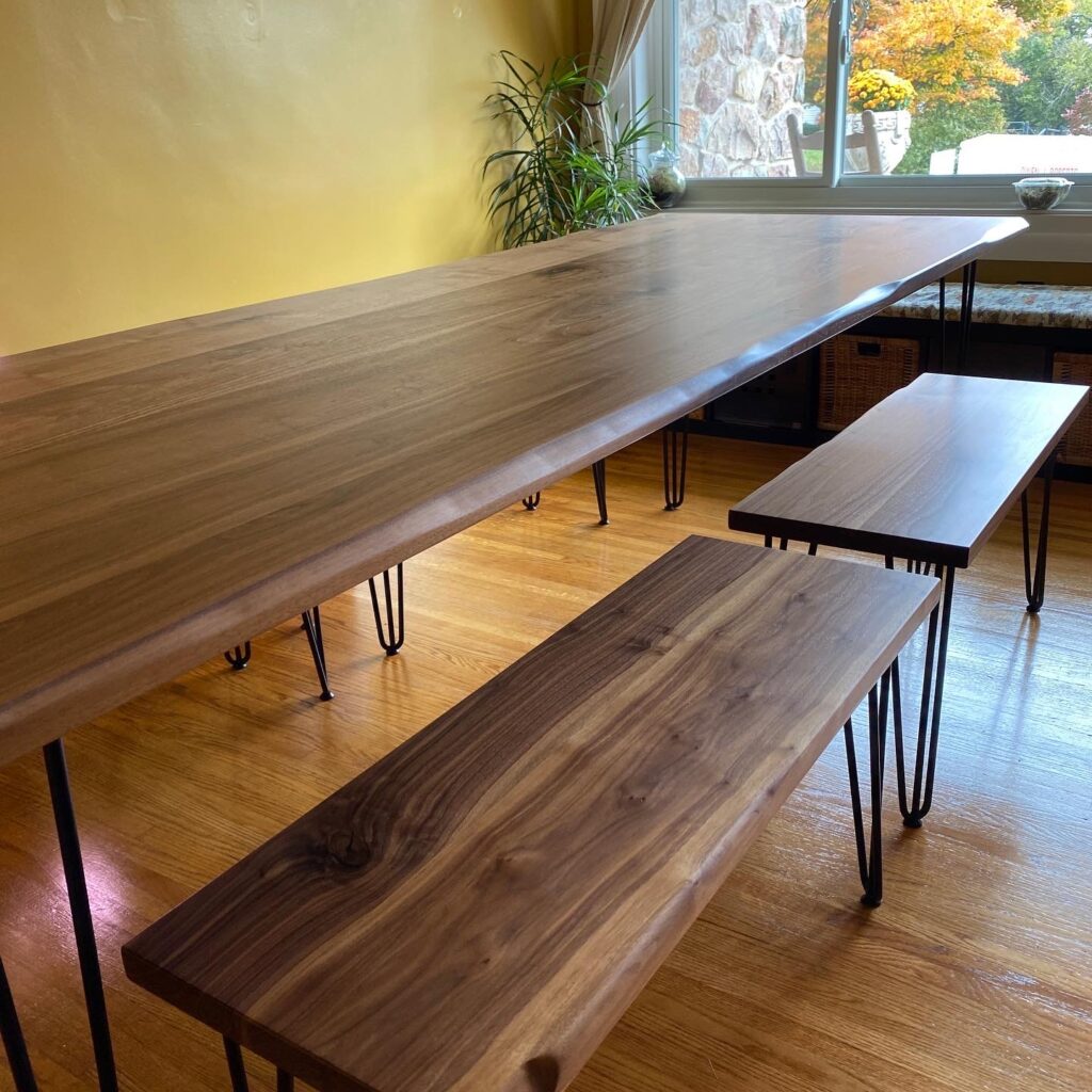 Live edge black walnut harvest table with matching bench seating
